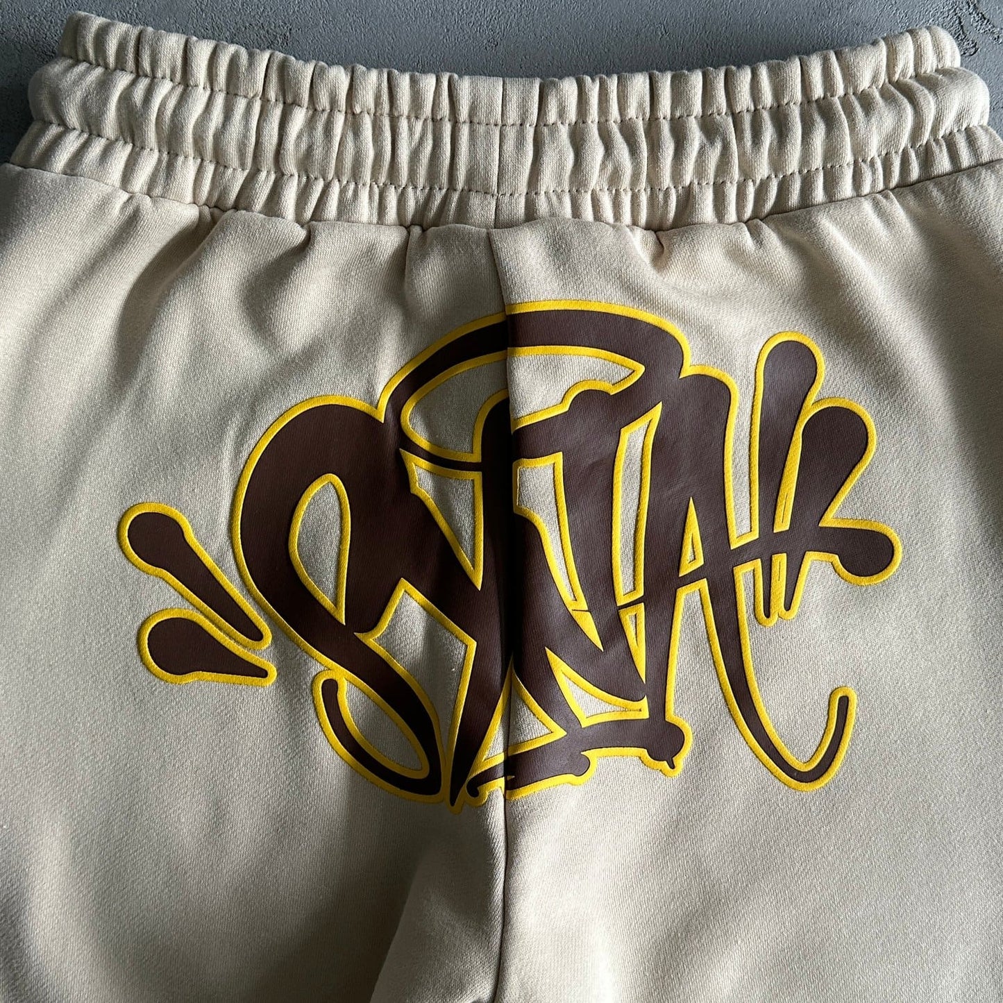 KHAKI SYNA WORLD